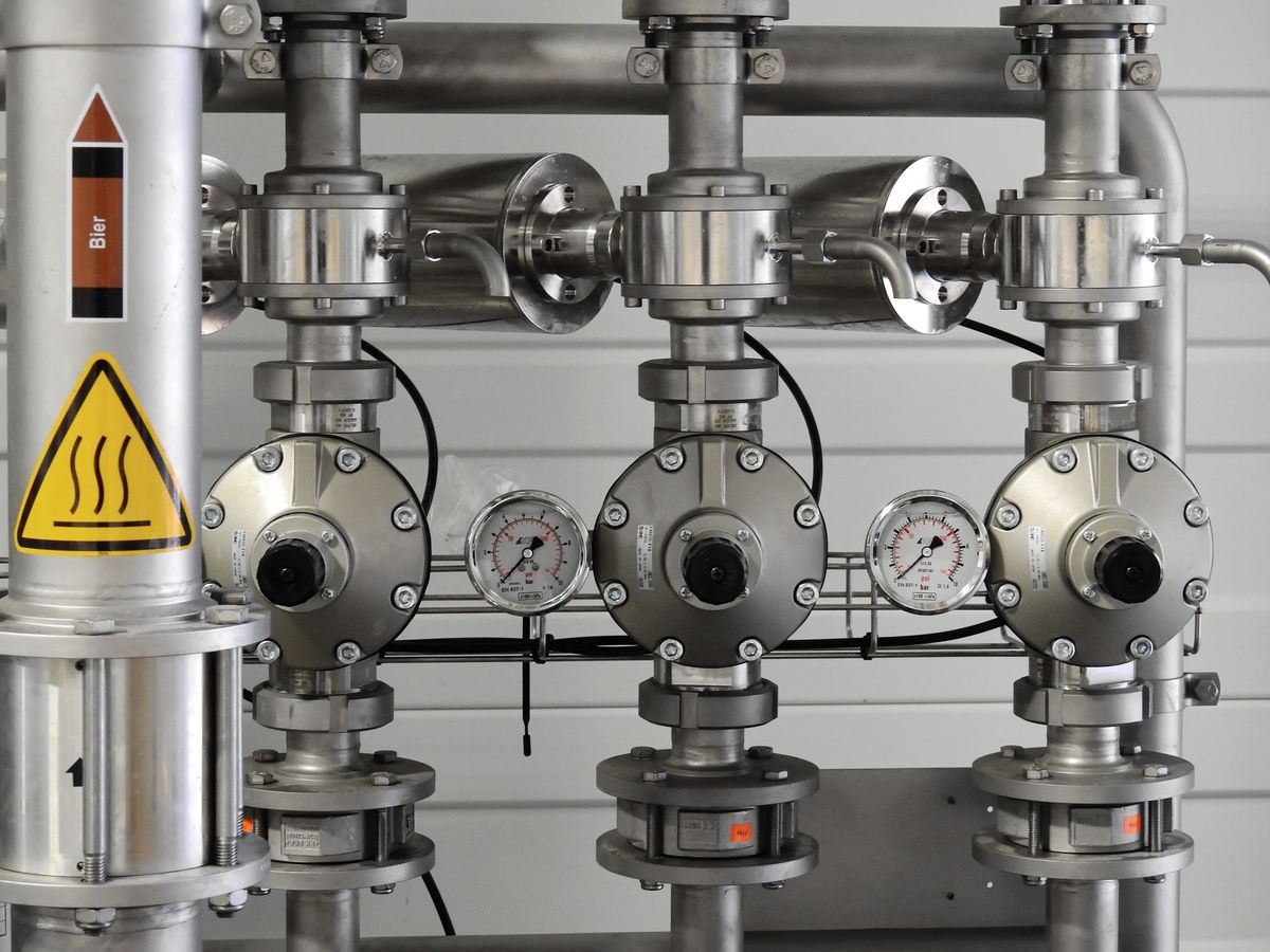 Stainless steel pipework with pressure gauges and isolation valves