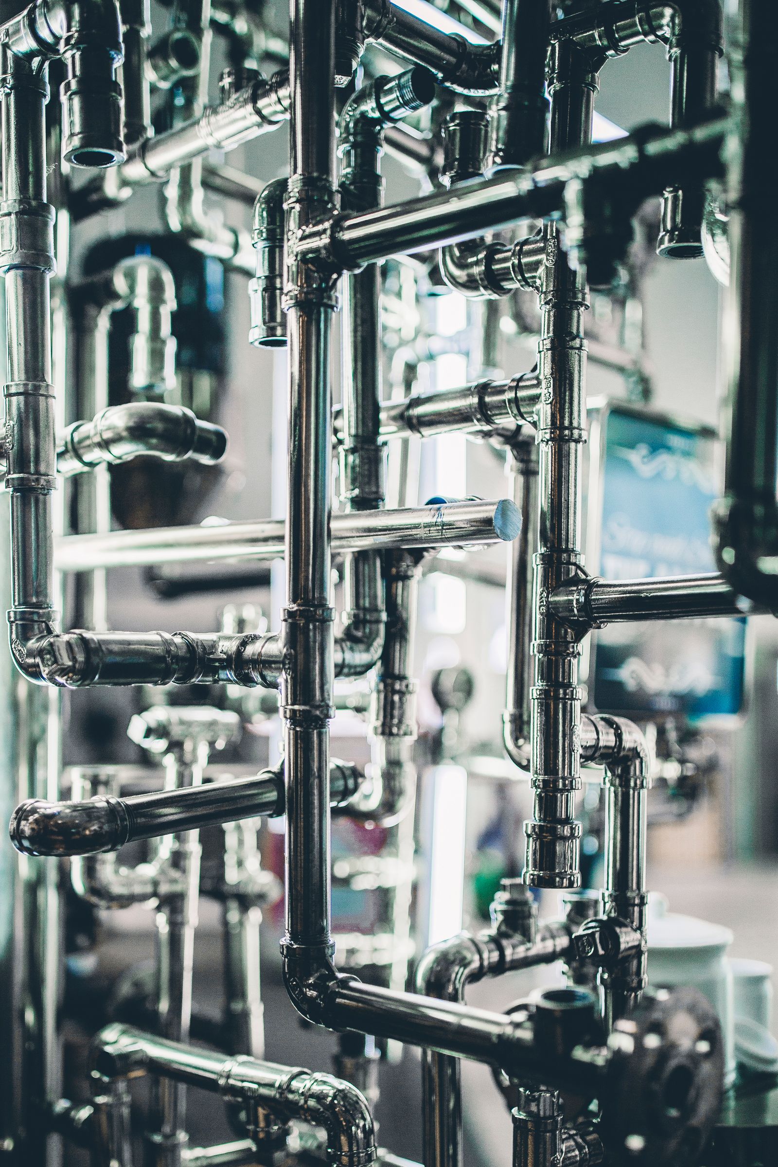 Dense network of polished steel pipework and fittings